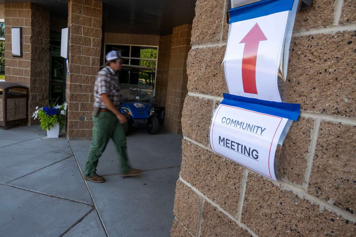 A man walks into Beaver High School for a community meeting discussing the Cottonwood Fire, which is burning on the mountains east of Beaver, on Monday. One-third of the town's residents were at the meeting. (Photo: Scott G Winterton, Deseret News)