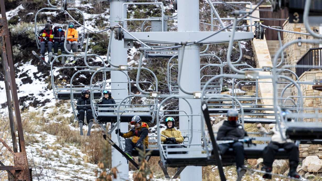 Skiers and snowboarders ride Park City Mountain Resort's Town Lift near Main Street in Park City on...