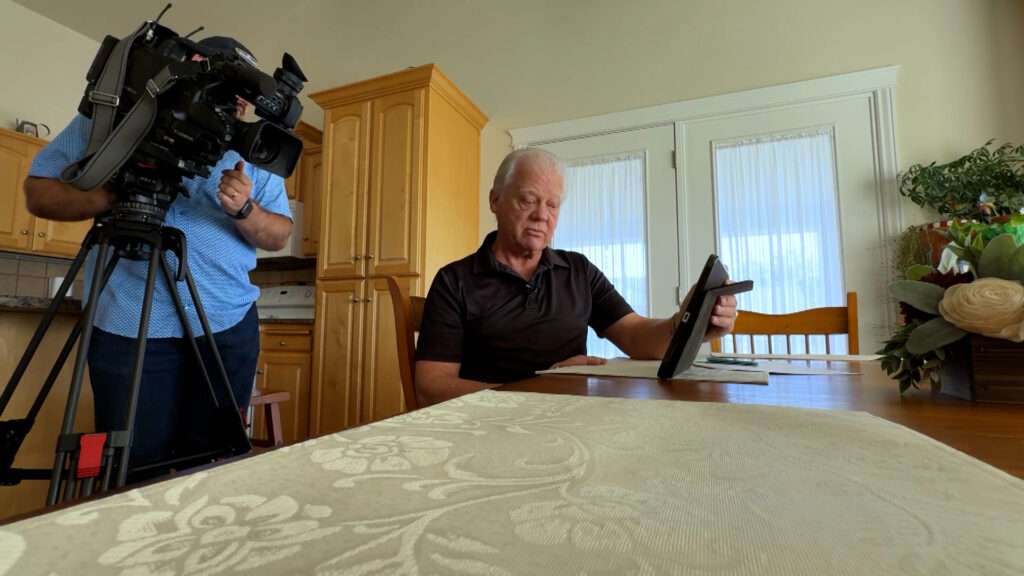 Henry Dall shows the website where he purchased six bottles of a supplement that promised a "no questions asked" guarantee. (Photo: Matt Gephardt, KSL)