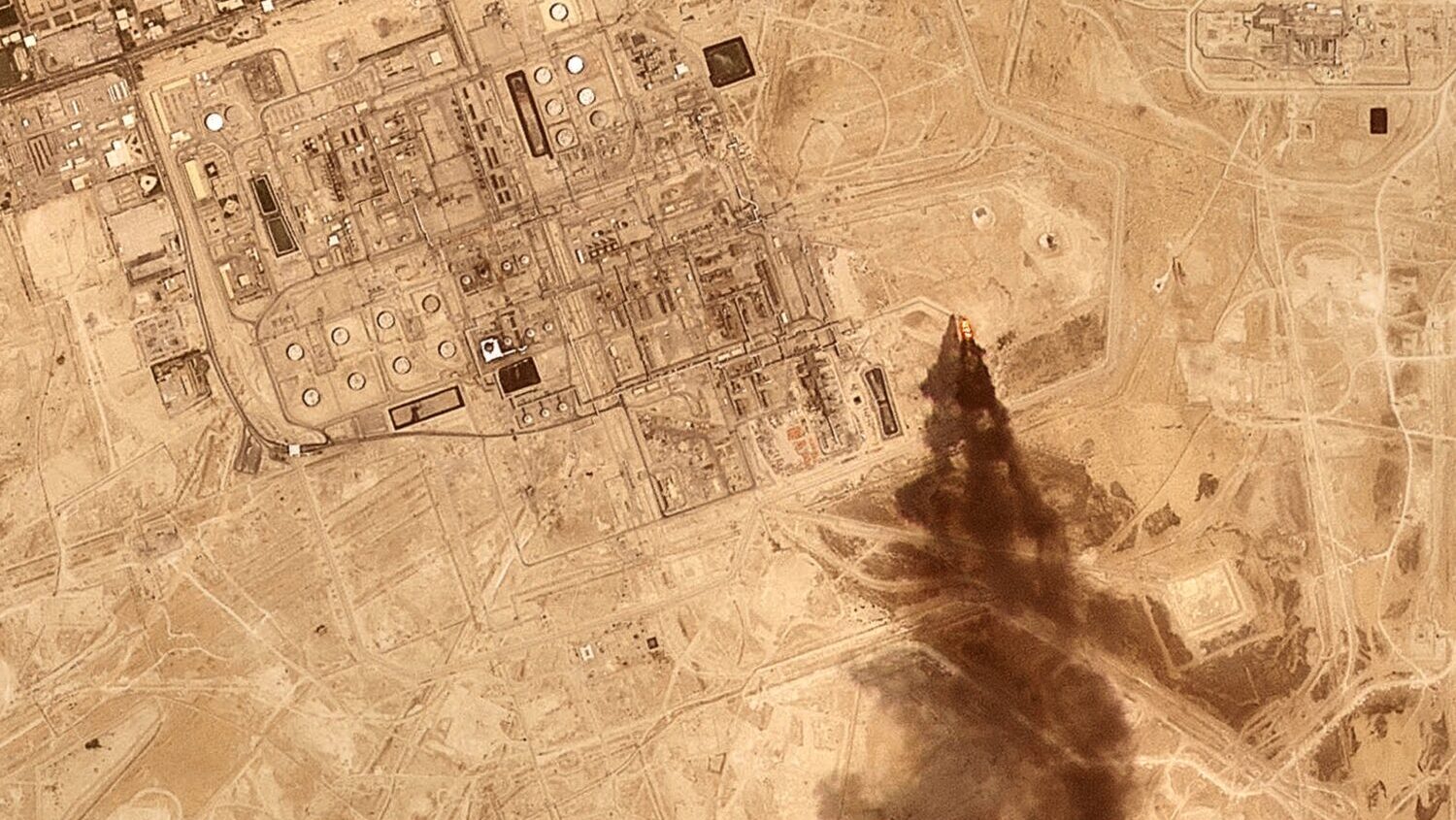 This satellite image provided by Planet Labs PBC on July 27, 2026 shows smoke rising from the Saudi...