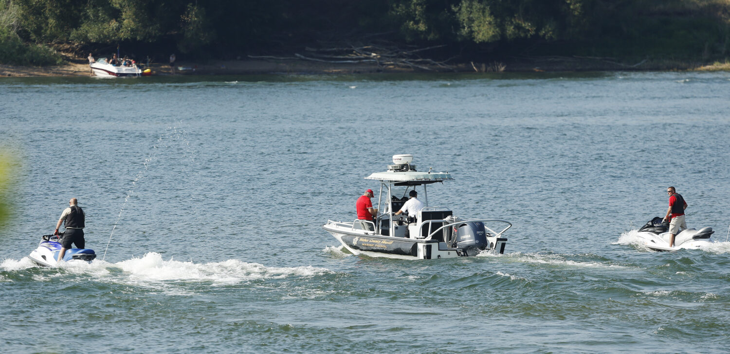 Weber County SAR crews transport a body found in the water at Anderson Cove on Pineview Reservoir on Saturday, July 19, 2014. The body was discovered by fisherman near the shore. Jeffrey D. Allred, Deseret News