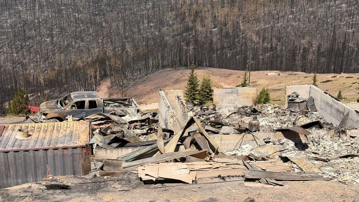 Charred remains of houses and vehicles in Eagle Point Resort’s West Village outside of Beaver, Tuesday, after the Cottonwood Fire torched much of the area. Matt Clarke is one of the residents who lost property in the fire. (Photo: Steve Mayer)