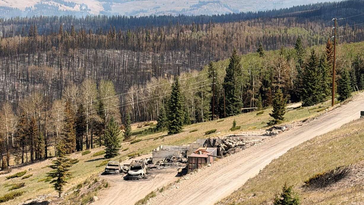 Charred remains of houses and vehicles in Eagle Point Resort’s West Village outside of Beaver, Tuesday, after the Cottonwood Fire torched much of the area. The fire has destroyed over 150 structures so far. (Photo: Steve Mayer)