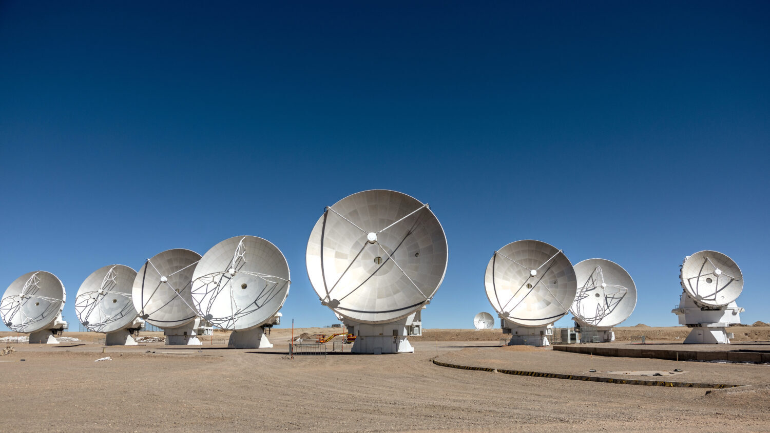 FILE: Massive antennas, part of the Atacama Large Millimeter/ submillimeter Array (ALMA) radio tele...