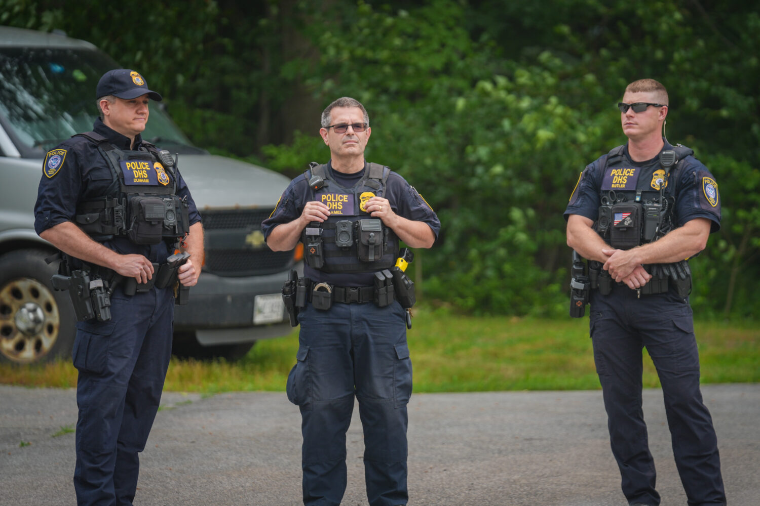 Department of Homeland Security (DHS) officers stand guard outside of a federal immigration office after a man was fatally shot by U.S. Immigration and Customs Enforcement (ICE) agents, on July 14, 2026 in Scarborough, Maine. (Ryan Murphy, Getty Images)