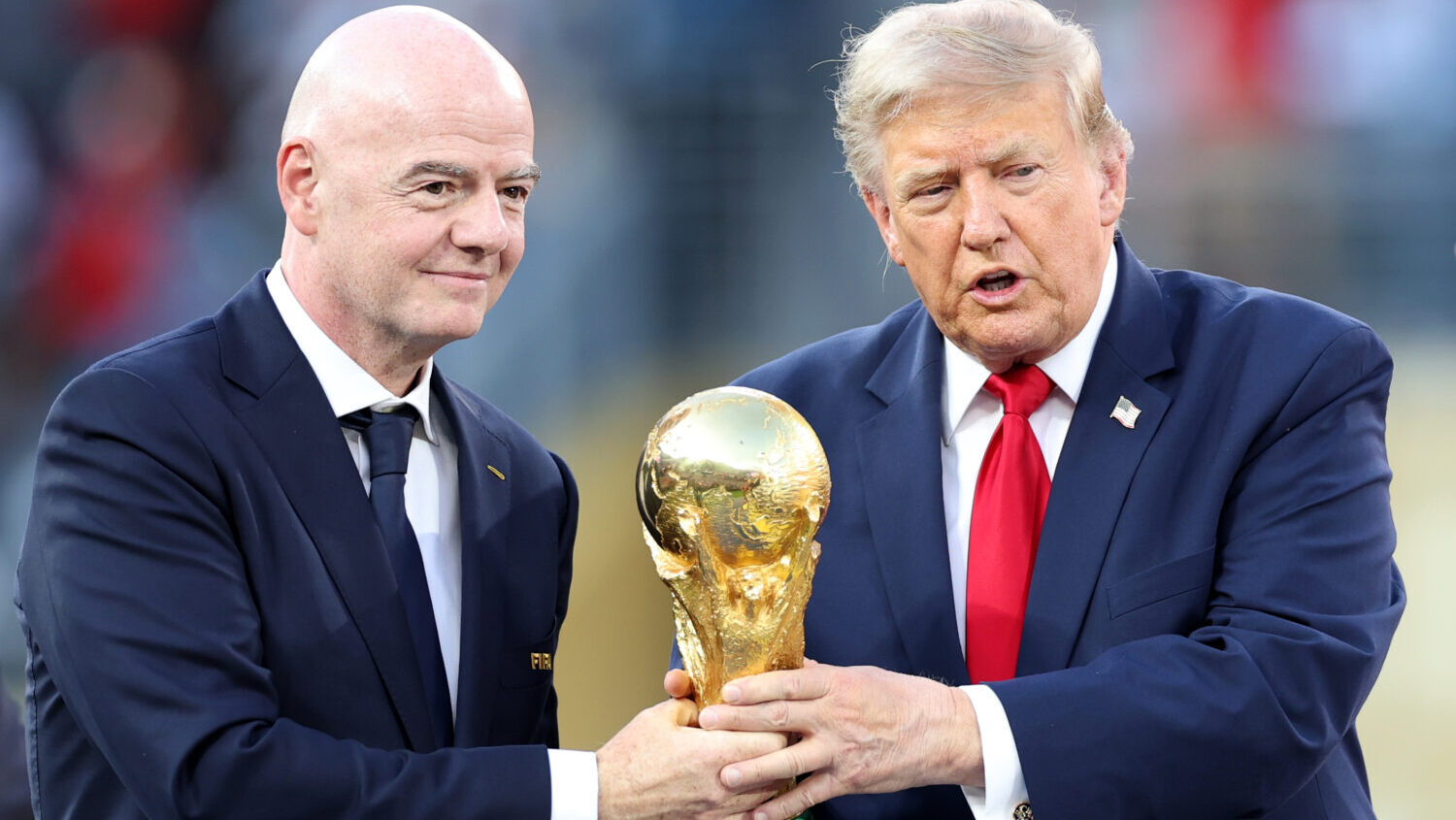 FILE: U.S. President Donald Trump and FIFA President Gianni Infantino hold the FIFA World Cup Winne...
