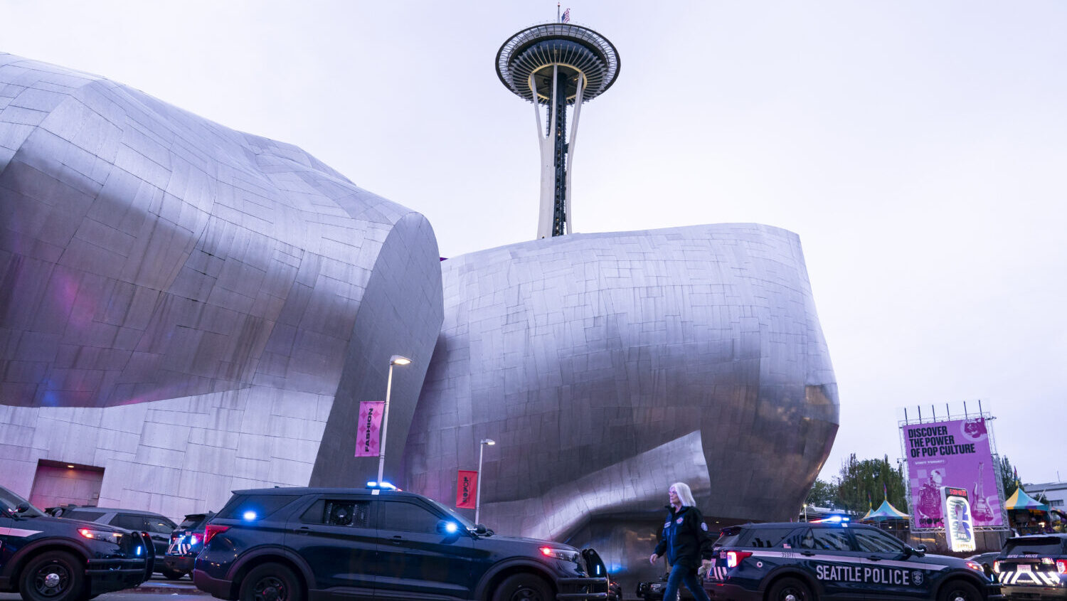 Police vehicles are parked near the location of a mass shooting at the Bite of Seattle food festival on July 26, 2026 in Seattle, Washington. Three people are dead and there are multiple people wounded after a mass shooting at the event at Seattle Center. (David Ryder, Getty Images)