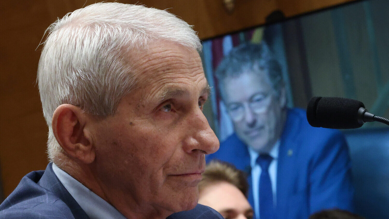Committee Chairmain Sen. Rand Paul (R-KY) is shown on a monitor as former NIH Director Anthony Fauci testifies before the Senate Homeland Security and Governmental Affairs Committee hearing on July 29, 2026 in Washington, DC. Fauci was expected to be questioned about his diary entries during his handling of the COVID-19 pandemic. (Kevin Dietsch, Getty Images)