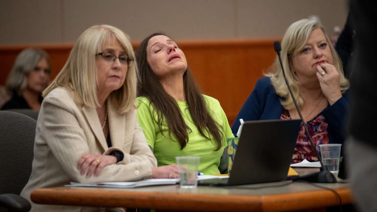 Kouri Richns, convicted of murdering her husband, reacts during her sentencing in 3rd District Cour...