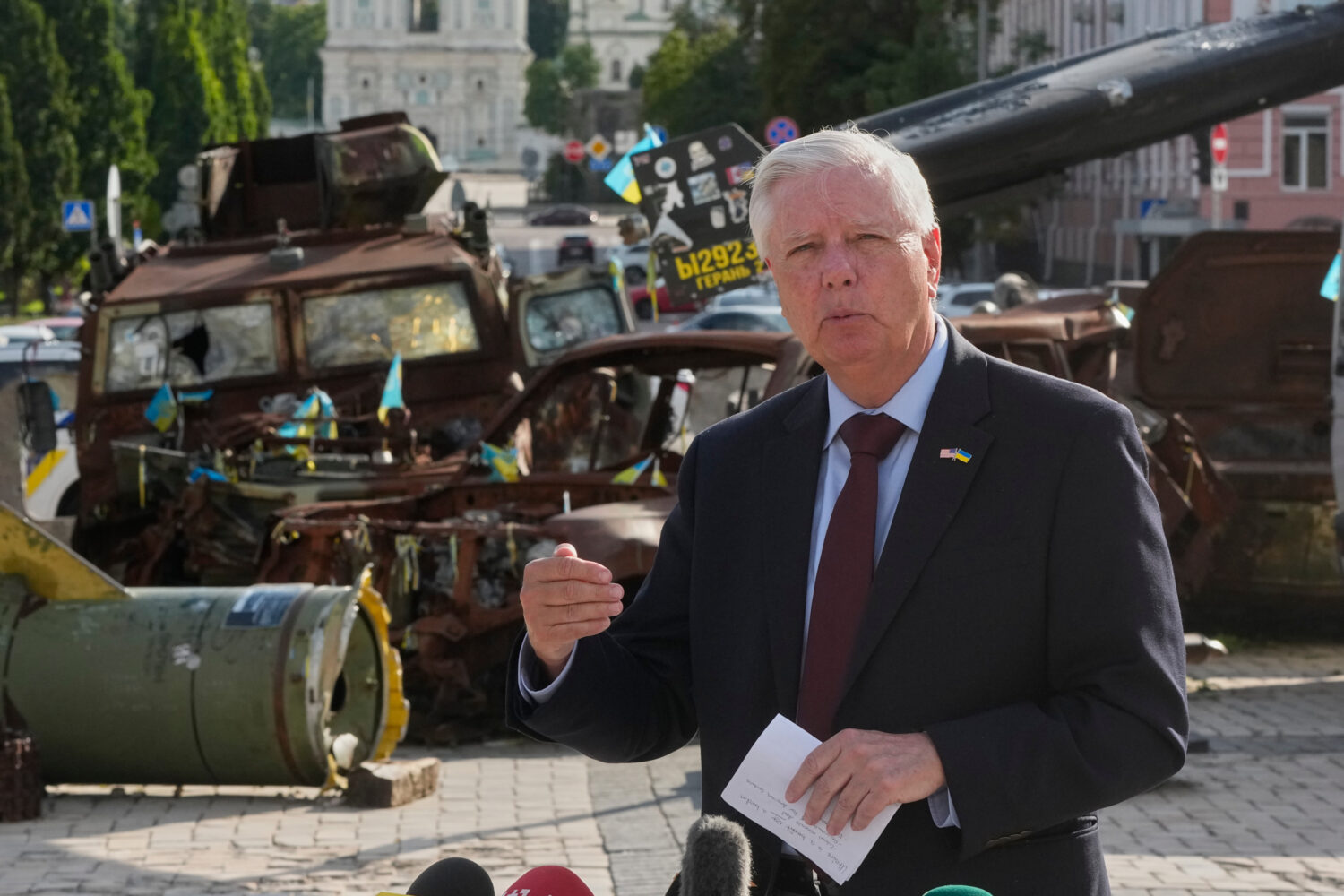 FILE - U.S. Sen. Lindsey Graham, R-S.C. answers questions from the media near an exhibition of dama...