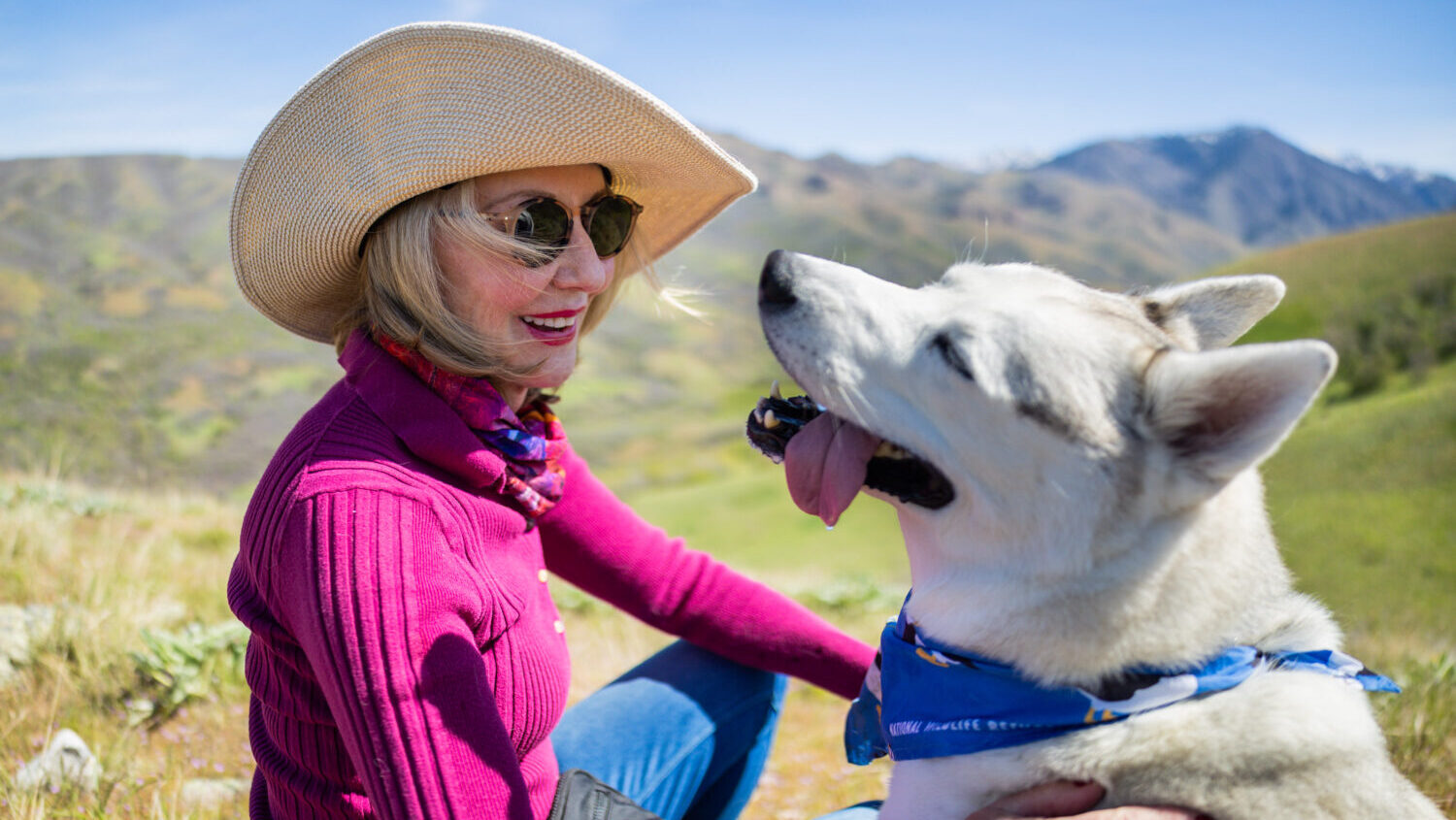 Mary Dickson, a downwinder and cancer survivor who grew up in Salt Lake City in the path of radioactive fallout during the Cold War, pauses while on a walk with her 3-year-old husky in the foothills in Salt Lake City on Saturday, May 2, 2026. (Tess Crowley, Deseret News)