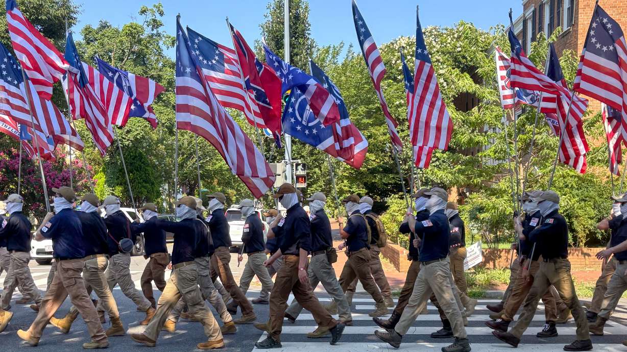 In this image provided by Mark Sherman, members of the Patriot Front march through Washington on In...