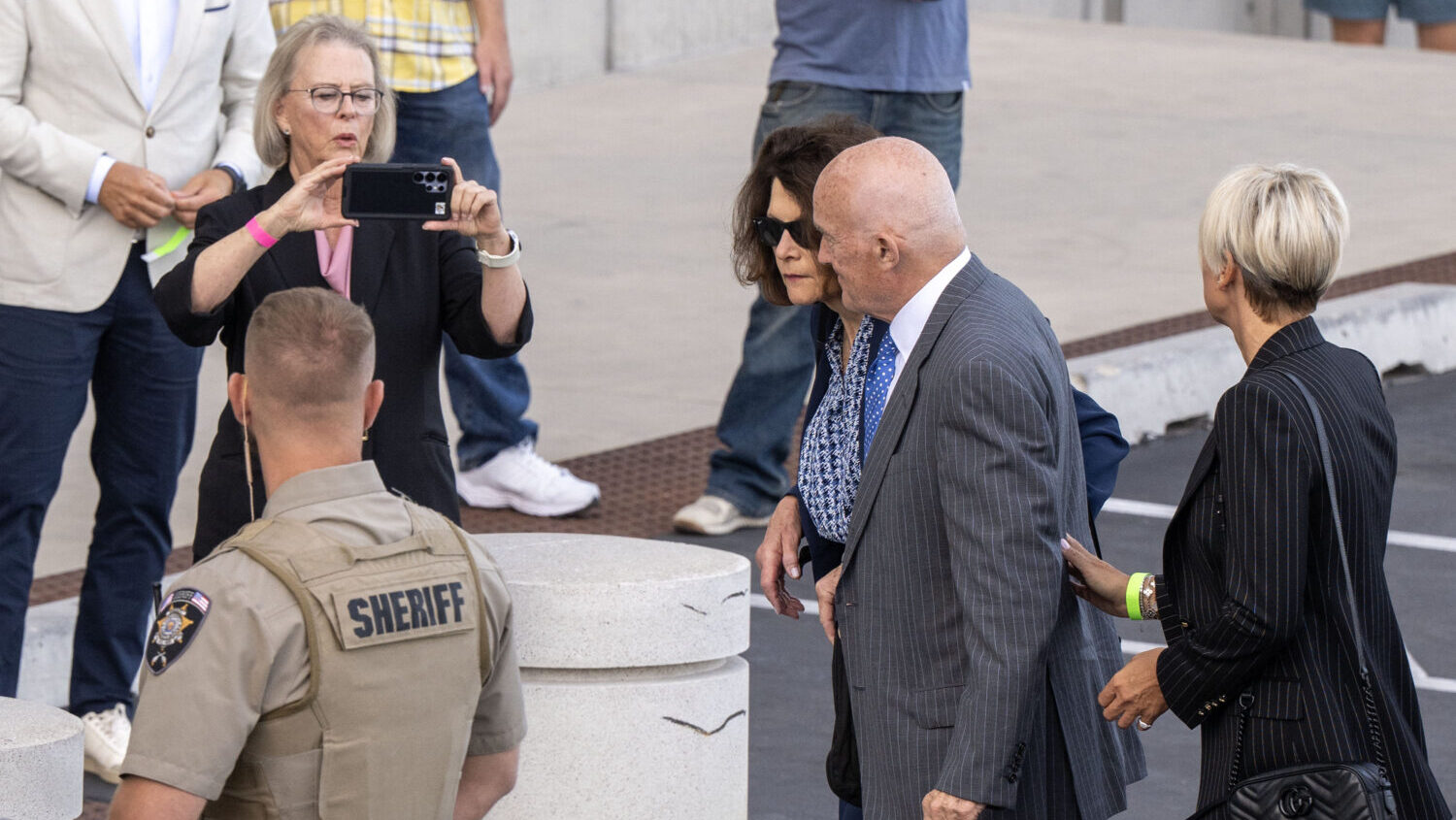 Robert and Kathryn Kirk, parents of Charlie Kirk, enter the 4th District Courthouse in Provo, surrounded by media, ahead of a preliminary hearing for Tyler Robinson, who is charged in the killing of Charlie Kirk, on Monday, July 6, 2026. (Scott G Winterton, Deseret News)