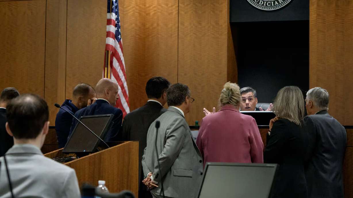 Tyler Robinson, left, who is accused in the fatal shooting of Charlie Kirk, sits while judge Tony G...