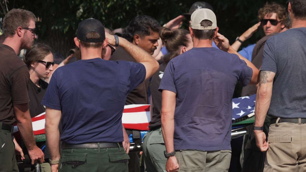 The body of a firefighter who died battling wildfires near the Colorado-Utah border is carried during a procession in Grand Junction, Colo., Monday. Three firefighters were killed and two more were injured in the Snyder Fire. (Photo: Ty O'Neil, Associated Press)