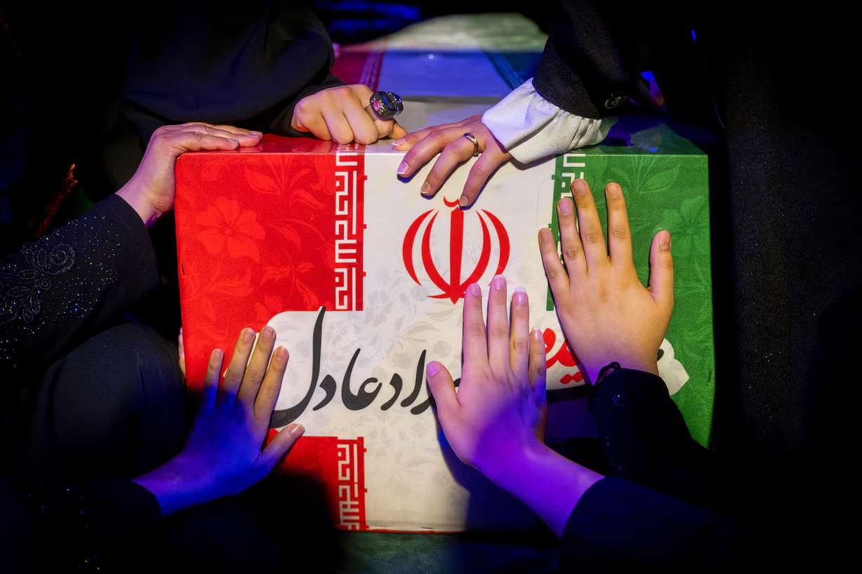 Mourners touch the coffin of Zahra Haddad-Adel, daughter of former Iranian parliament speaker Gholam-Ali Haddad-Adel and wife of Iran's Supreme Leader Mojtaba Khamenei, during her funeral in Tehran, Thursday, July 2. According to Iranian authorities, she was killed in the same strike that killed then-Supreme Leader Ali Khamenei.