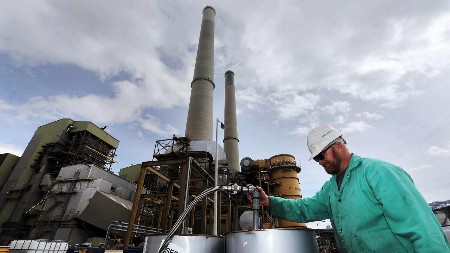 Russ Willson moves used oil for recycling at the Huntington power plant in Huntington, Tuesday, March 24, 2015. (Ravell Call, Deseret News)