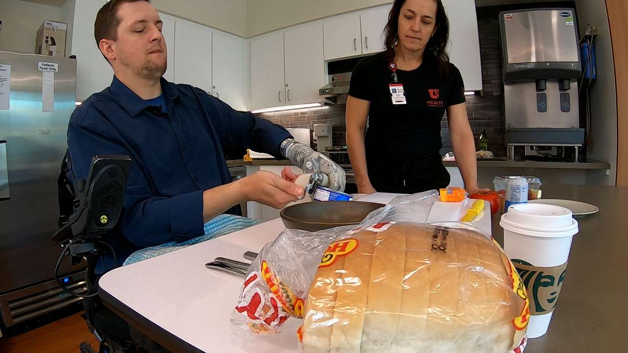 Alexander "Avi" Davidson, a therapist from Tampa, Florida, and occupational therapist Leanne Seckinger make a tuna melt sandwich on April 17. (Photo: Peter Rosen, KSL)