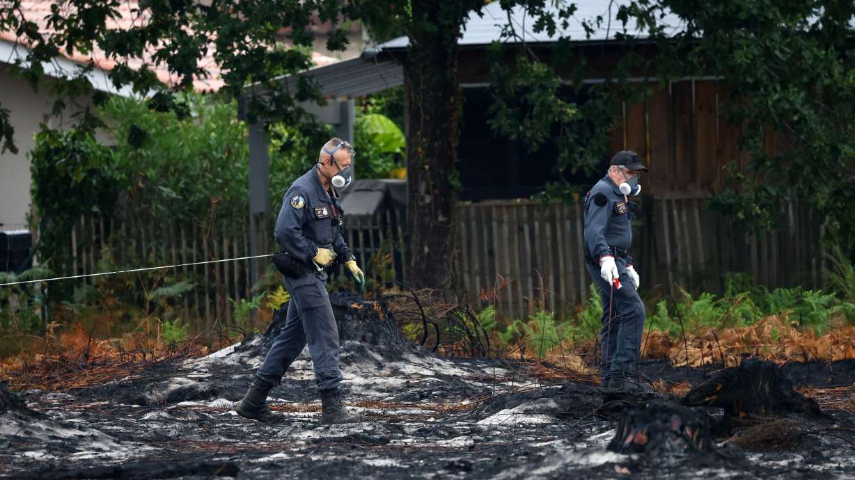Bomb disposal experts work on a site after the discovery of shells from World War II in a neighborh...