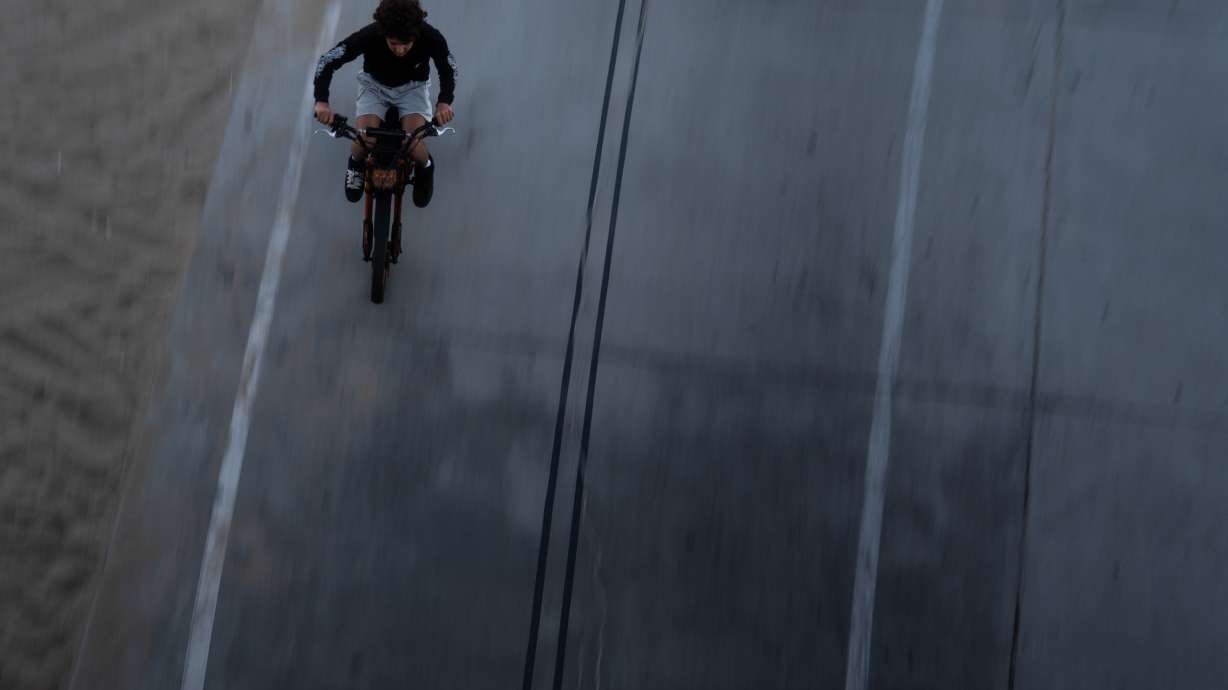 A boy rides an e-bike in Santa Monica, Calif., Monday. (Jae C. Hong, Associated Press)...