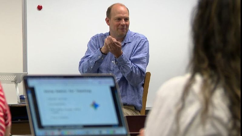 Jonathan Stewart demonstrates AI program for teachers in the Canyons District. He used AI to turn h...