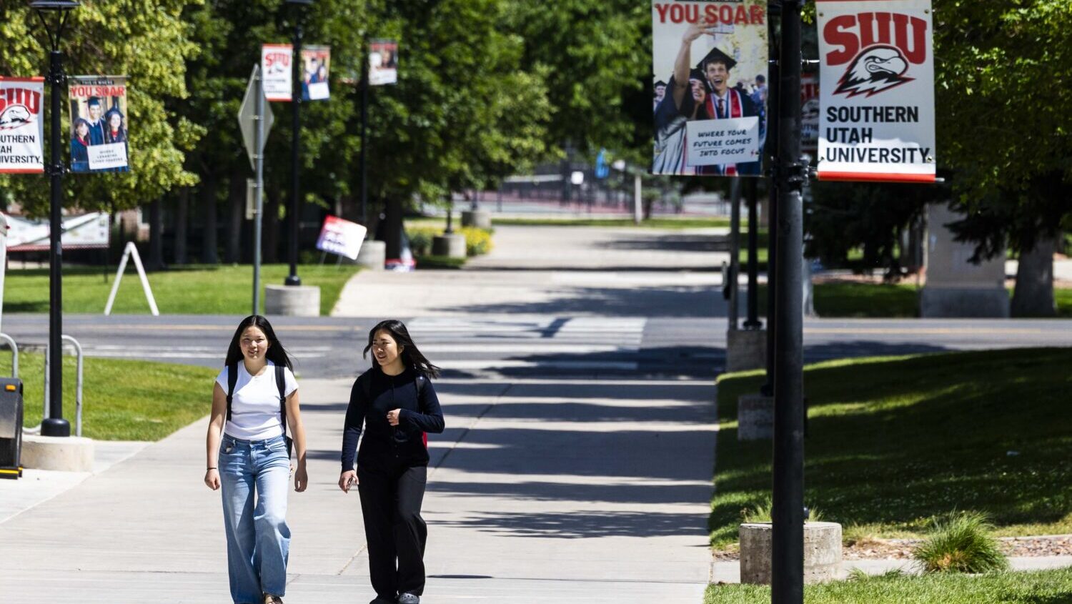 People walk on the campus of Southern Utah University in Cedar City on Friday, June 20, 2025. (Brice Tucker, Deseret News)