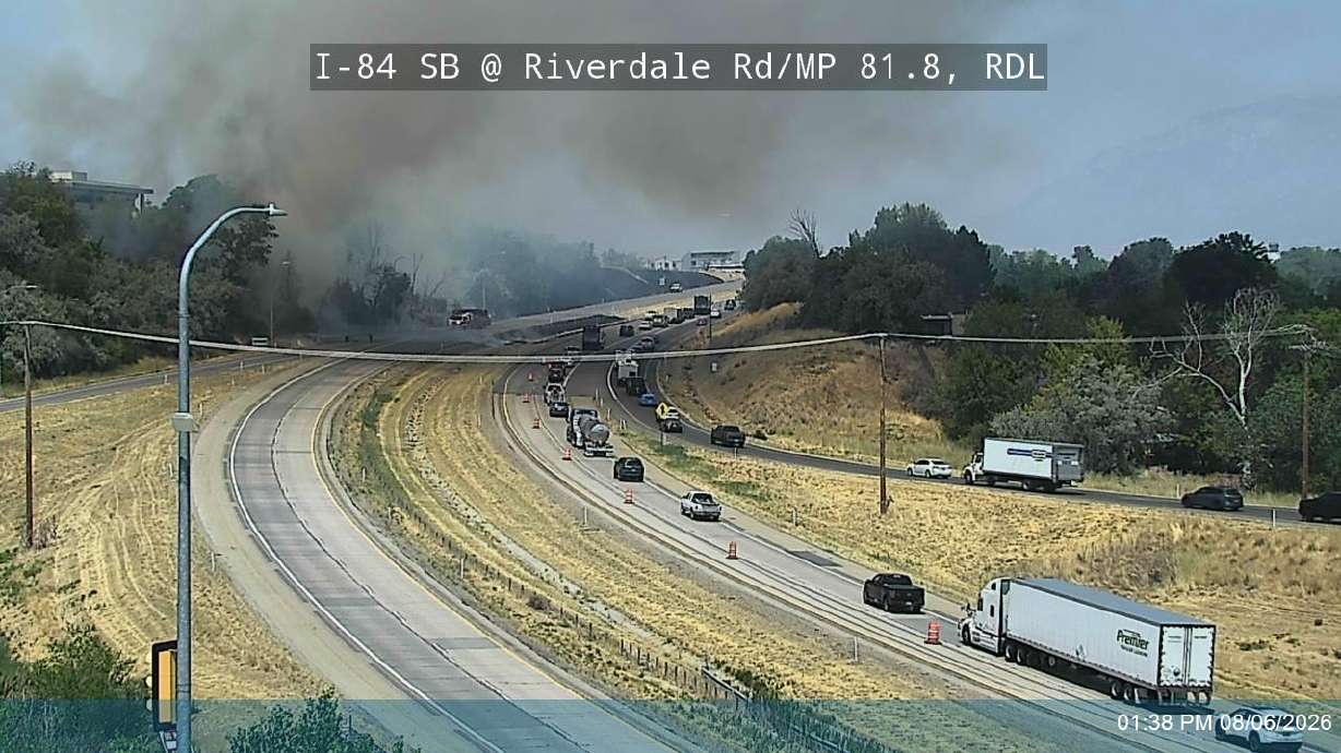 Smoke rises from a fire along Interstate 84 in Riverdale on Thursday. At one point, flames were vis...