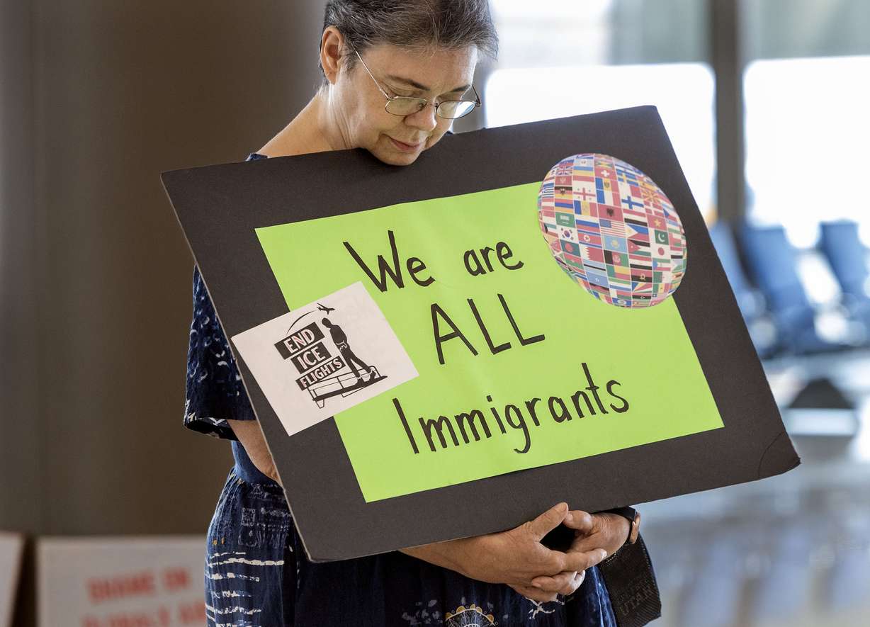 Sue Widdison stands near the baggage claim area of the Salt Lake City International Airport on Thursday, Aug. 6, 2026. A group of Utah residents gathered at the baggage claim in the main terminal to inform returning passengers about the numbers of immigrants being flown out of Salt Lake City on Monday and Thursday ICE flights. (Photo: Laura Seitz, Deseret News)