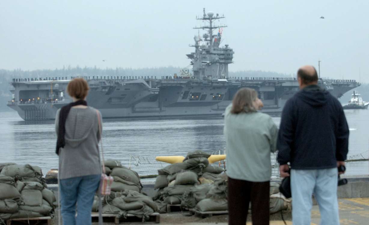 Family and friends gather to watch the USS Abraham Lincoln as it leaves Naval Station Everett in Washington state, Friday, Oct. 15, 2004. (Photo: Ron Wurzer)