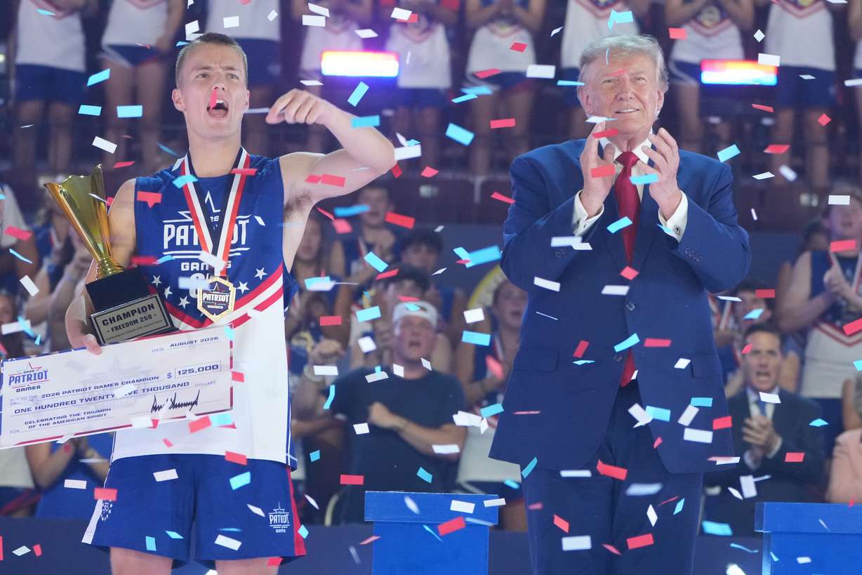 Utah's Rockwell Myers, left, celebrates with President Donald Trump at the Patriot Games at Spire Academy in Geneva, Ohio, Tuesday. (Photo: Mark Schiefelbein, Associated Press)