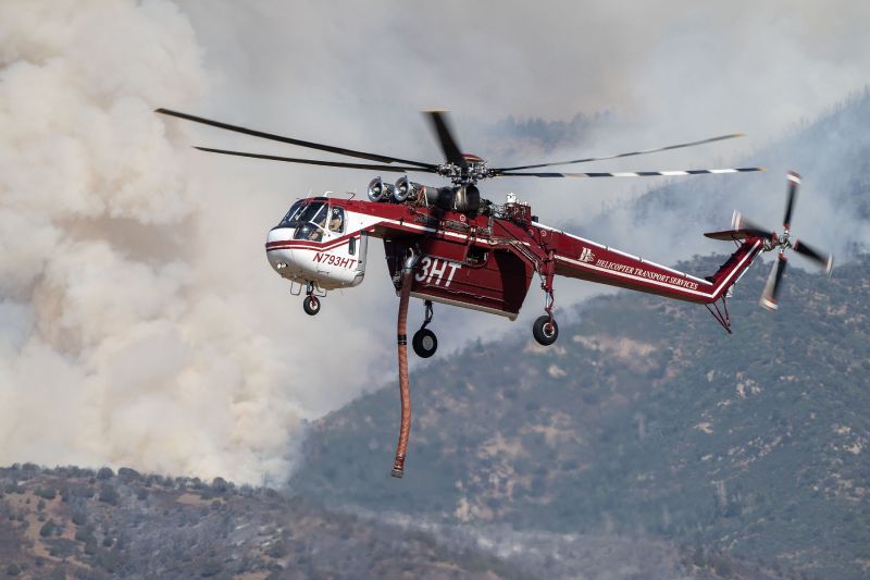 A Sikorsky Skycrane approaches to refill as crews fight the Widemouth 2 Fire east of Fillmore, Utah, on Tuesday, Aug. 4, 2026. (Scott G Winterton, Deseret News)
